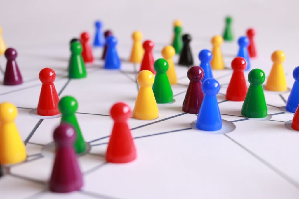 play-stone-network-networked-interactive-163064 Close Up Photography of Yellow Green Red and Brown Plastic Cones on White Lined Surface